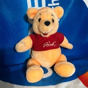 Winnie the Pooh plush toy with movable arms and legs, music feature doesn’t work